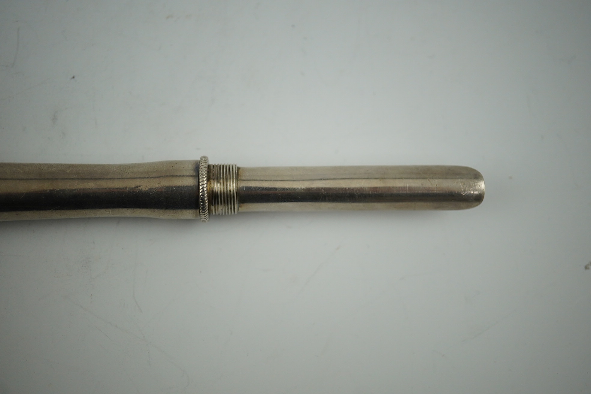 A George IV silver travelling apple corer, maker W?